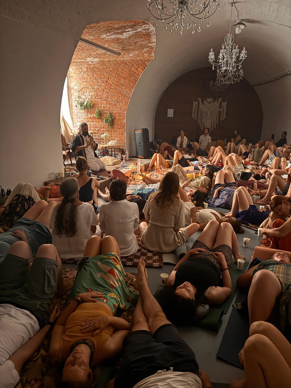 A gathering lying in stillness during ceremony.